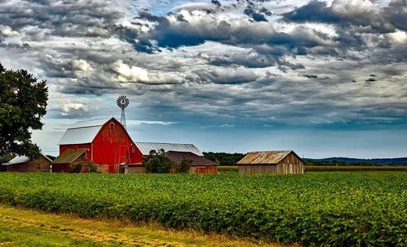 Red barn and windmill on a rural farmstead